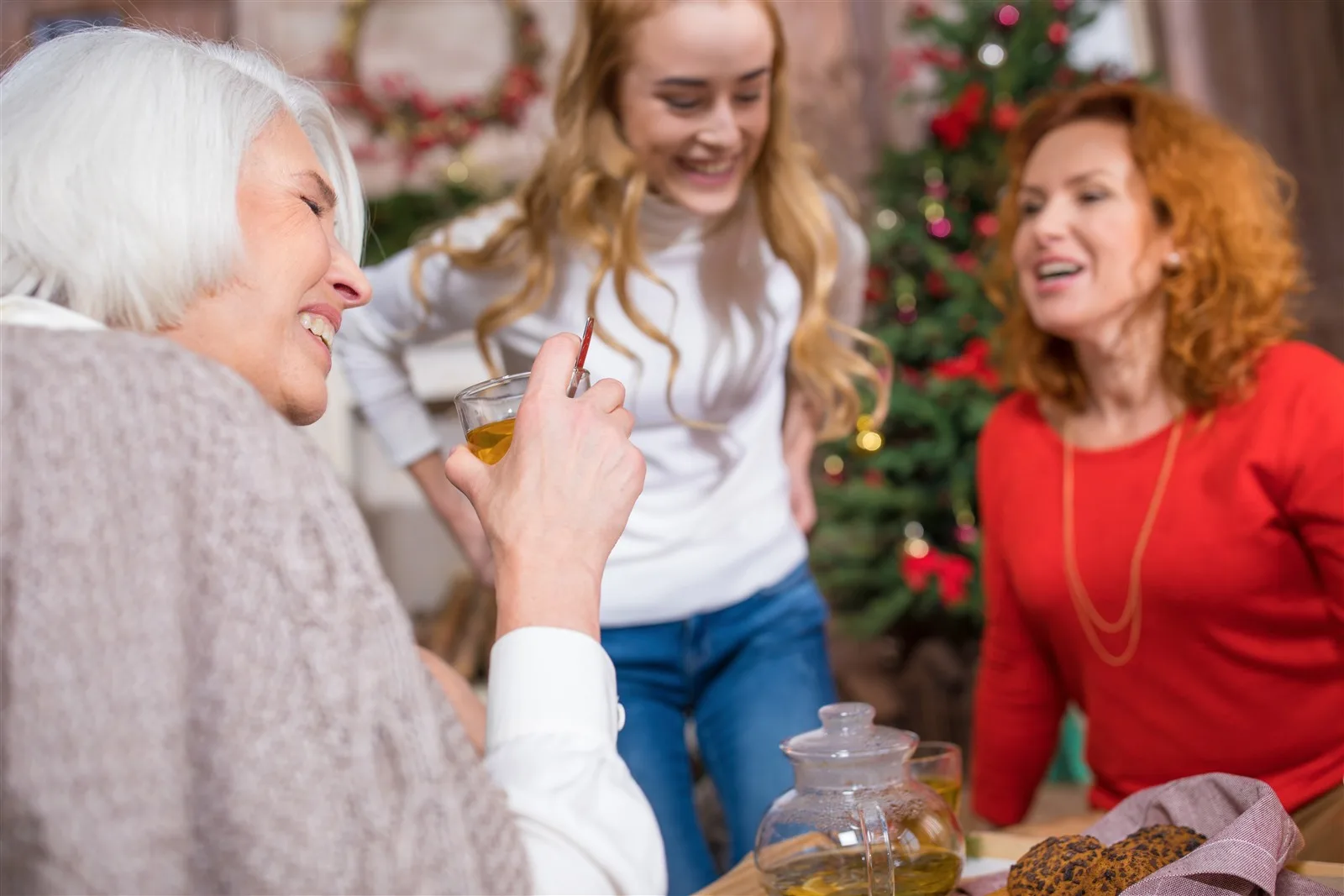 Older woman celebrating Christmas with family